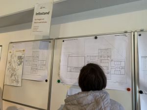OSK Neubaupläne hängen an der Wand